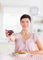 Cute brunette Woman toasting with wine