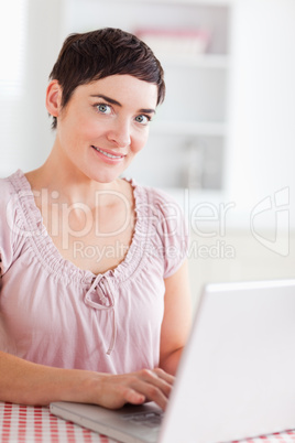 Smiling Woman working with a laptop