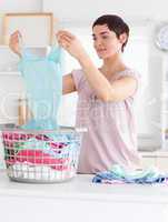 Cute Woman folding clothes