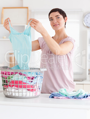Charming Woman folding clothes