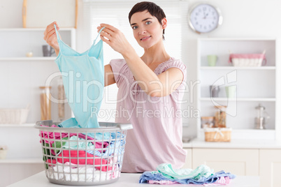 Smiling Woman folding clothes