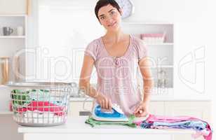 Cute Woman ironing clothes