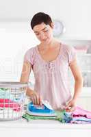 Charming Woman ironing clothes