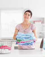 Charming Woman with a pile of clothes