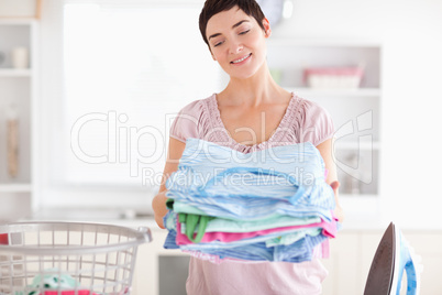 Gorgeous Woman with a pile of clothes