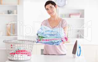 Beautiful Woman with a pile of clothes