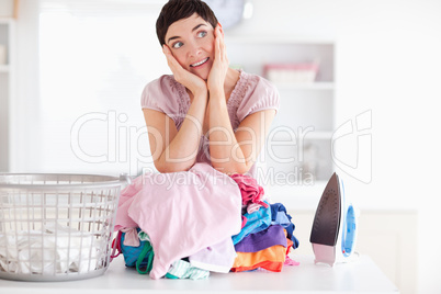 Cheerful Woman with a pile of clothes