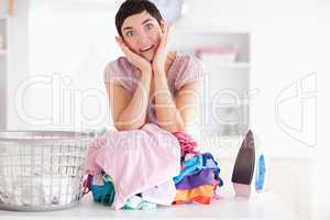 Surprised Woman with a pile of clothes