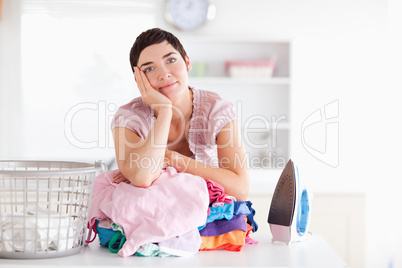 Bored Woman with a pile of clothes