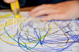 Closeup of a child drawing on paper