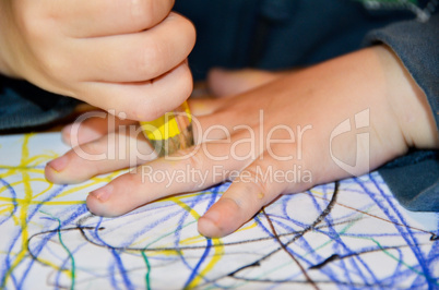 Closeup of a child drawing on paper