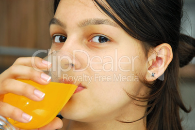 Girl portrait drinking juice