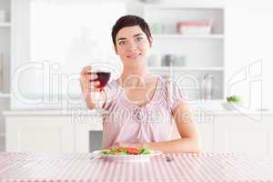 Cute Woman toasting with wine