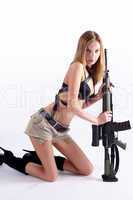 Beautiful woman with sniper rifle