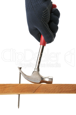 Carpenter pulls a nail.