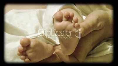 newborn baby feet stylized at reel movie