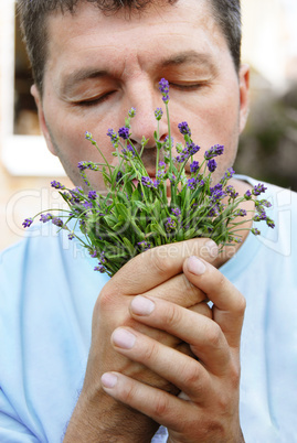 Man smelling lavender