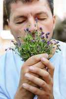 Man smelling lavender
