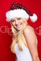 Blonde Frau mit Weihnachtsmütze