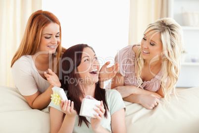 Laughing Girls giving their friend a present