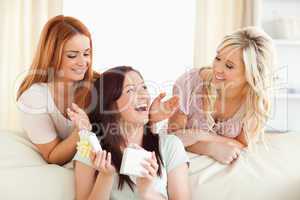Laughing Girls giving their friend a present