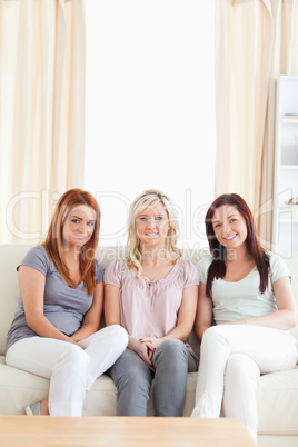 Cute women lounging on a sofa