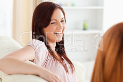 Charming women relaxing on a sofa