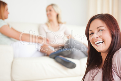 Smiling Women chatting on a sofa