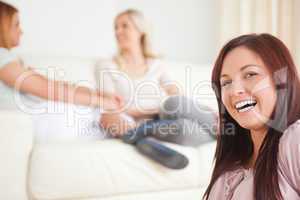 Smiling Women chatting on a sofa