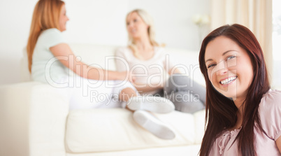 Charming Women chatting on a sofa