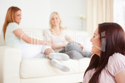 Cute Women chatting on a sofa