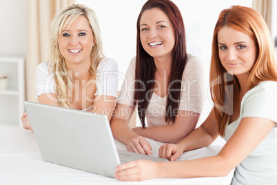 Cute Women sitting at a table with a laptop