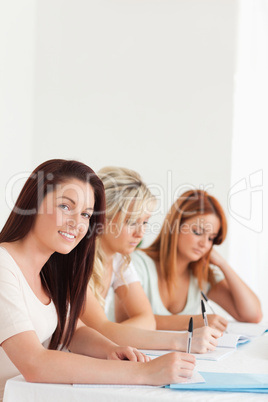 Portrait of smiling Students learning at a table