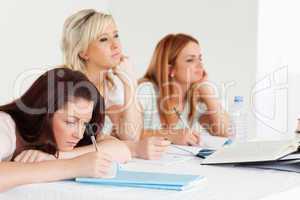 Bored students sitting at a table