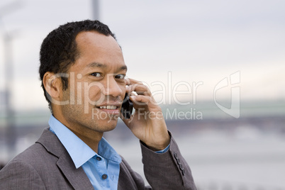 Afro Asian Businessman on the phone