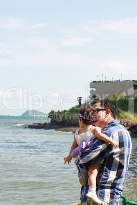 Father and duagther spending Sunday exploring Pacific Ocean