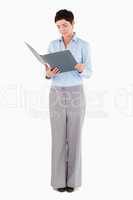 Woman looking at a binder