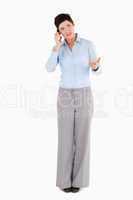 Unhappy woman making a phone call