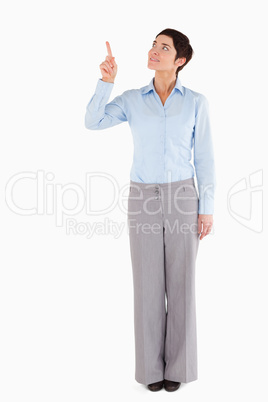 Businesswoman pointing at copy space