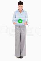 Businesswoman looking at a recycling box