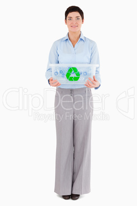 Businesswoman showing a recycling box