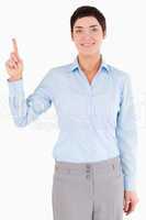 Portrait of a businesswoman pointing at copy space