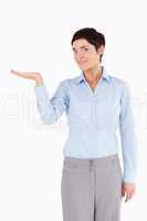 Businesswoman with hand open to show a copy space