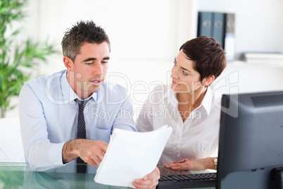 Coworkers looking at a document