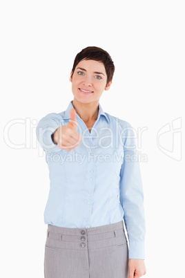 Portrait of a businesswoman with her thumb up