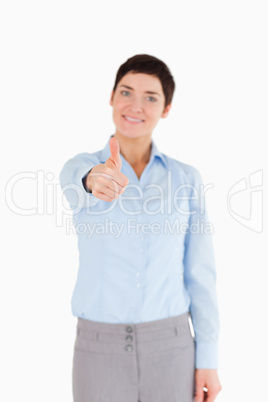 Portrait of a businesswoman with the thumb up