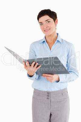 Portrait of a businesswoman holding a binder