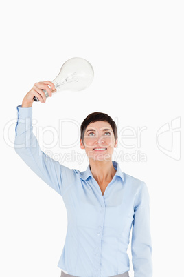 Businesswoman holding a light bulb