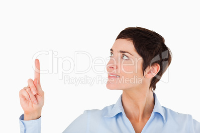 Close up of a businesswoman pointing at copy space