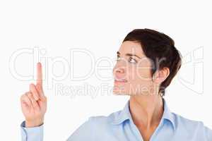 Close up of a businesswoman pointing at copy space